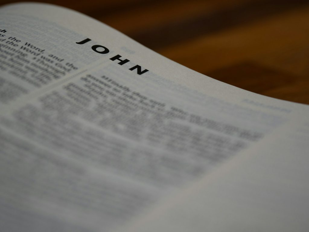 A close up of an open bible on a table